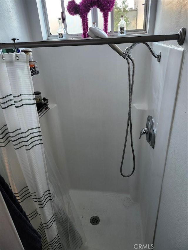 bathroom with a shower with curtain