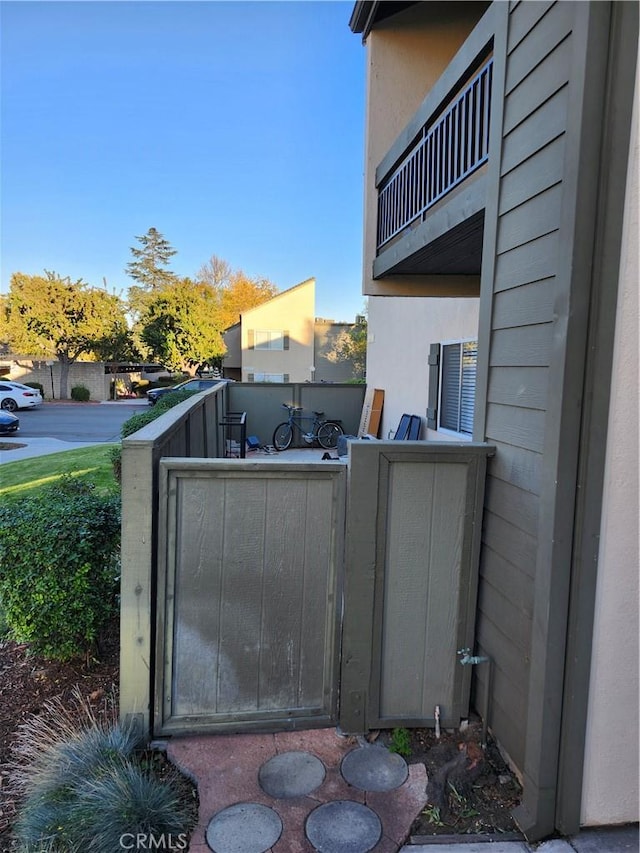 view of patio featuring a balcony