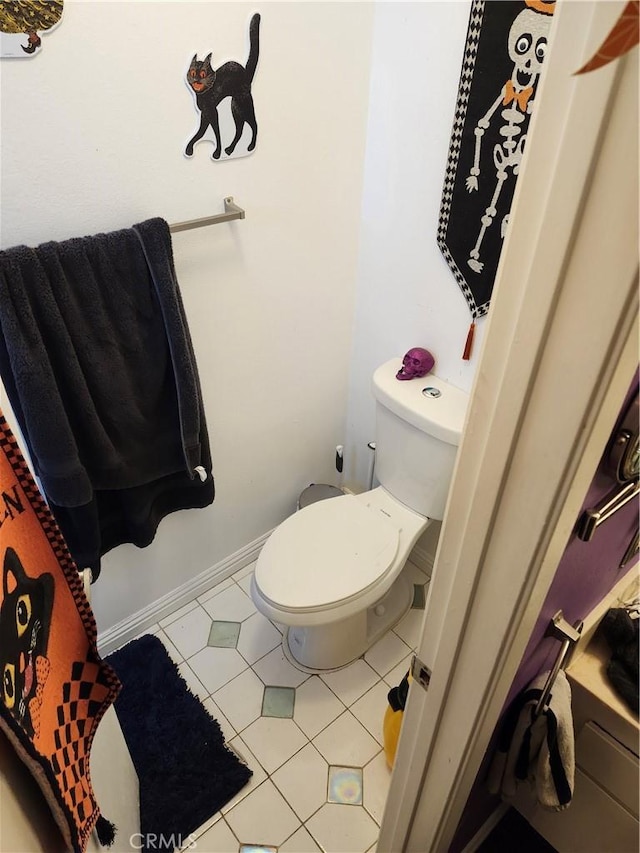 bathroom featuring tile patterned floors and toilet