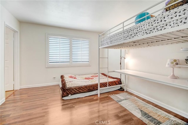 bedroom featuring hardwood / wood-style floors