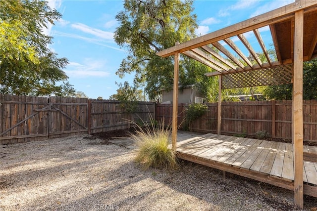 view of yard featuring a pergola and a deck