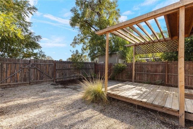 553 E 23rd St, Chico, CA 95928 - fenced backyard with a wooden deck and a gate