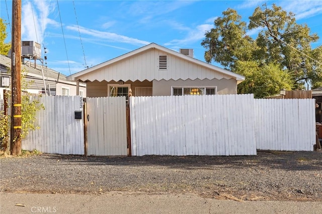 view of side of home with central AC