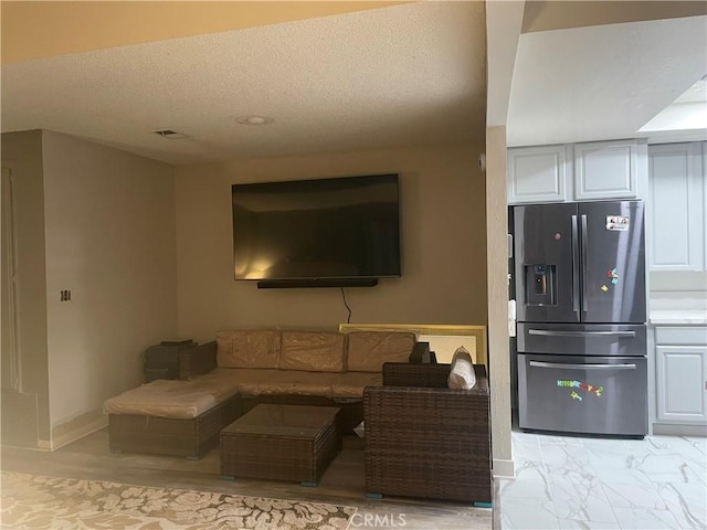 living room featuring a textured ceiling