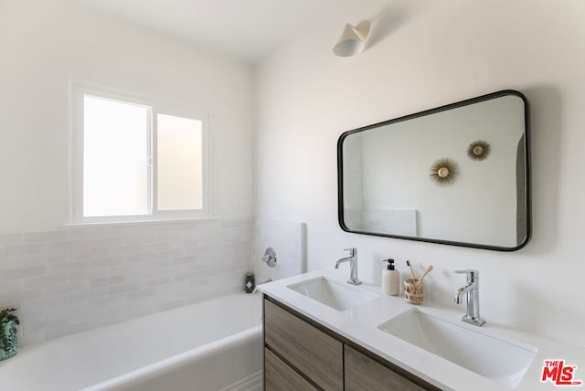 bathroom with vanity and a bathing tub