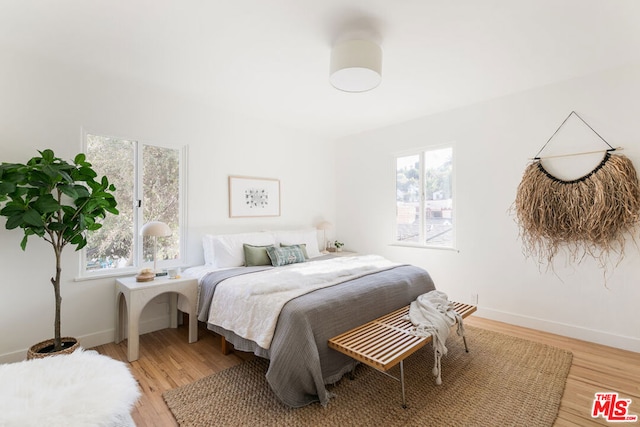 bedroom with light hardwood / wood-style floors