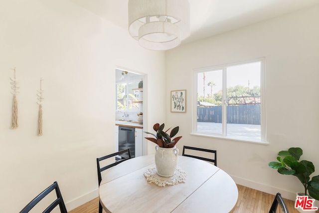 dining space with light hardwood / wood-style flooring