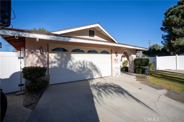 ranch-style house featuring a garage