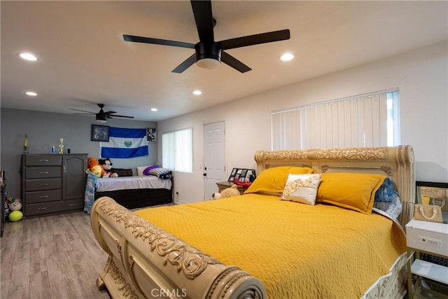 bedroom featuring ceiling fan and hardwood / wood-style flooring