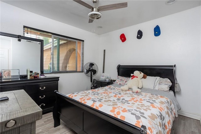 bedroom featuring ceiling fan and light hardwood / wood-style floors