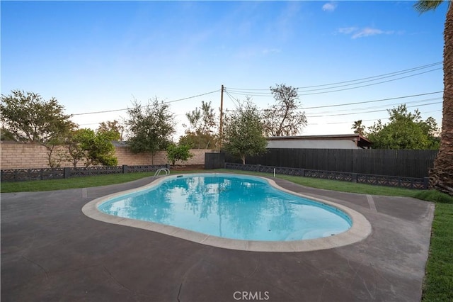 view of pool featuring a patio