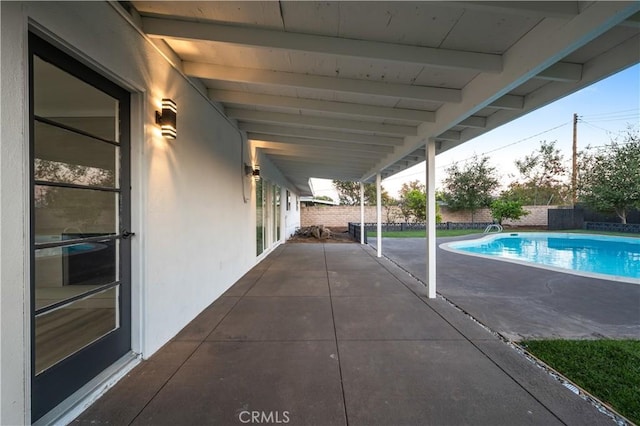 view of patio featuring a fenced in pool