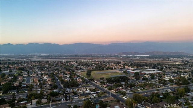 aerial view at dusk with a mountain view