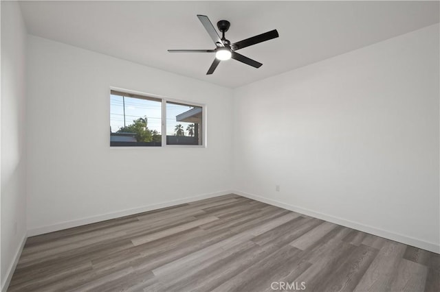 unfurnished room featuring ceiling fan and light hardwood / wood-style flooring