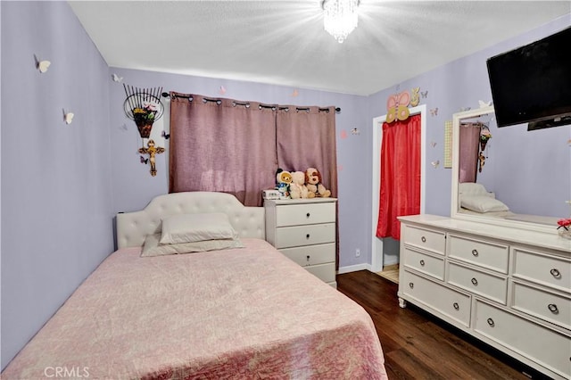 bedroom featuring dark wood-type flooring