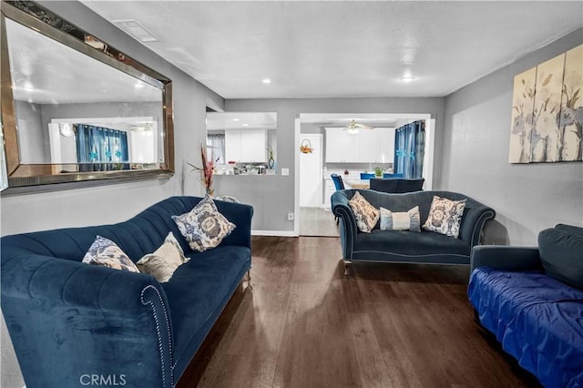 living room with dark hardwood / wood-style flooring and a textured ceiling