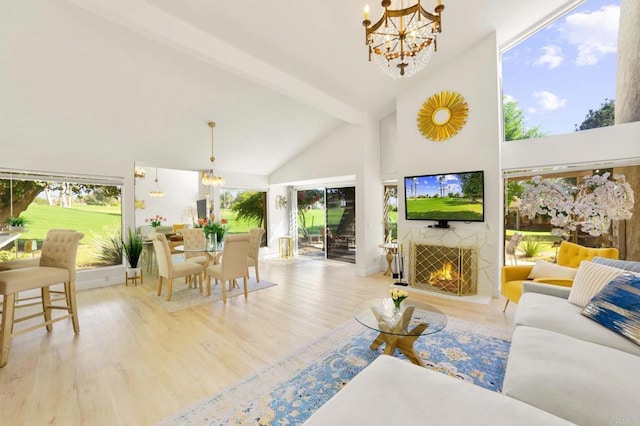 living room featuring beam ceiling, light wood-type flooring, high vaulted ceiling, and a chandelier