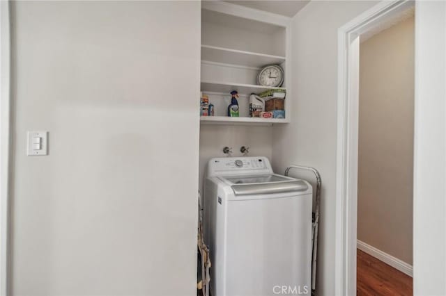 laundry area featuring wood-type flooring and washer / clothes dryer