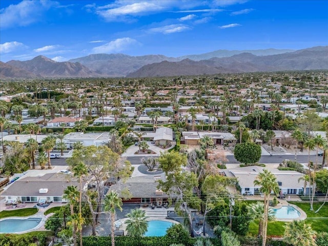 birds eye view of property featuring a mountain view