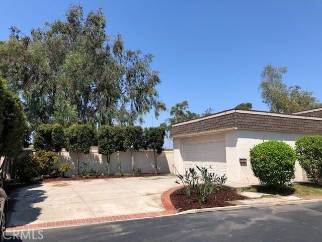 view of property exterior with a garage