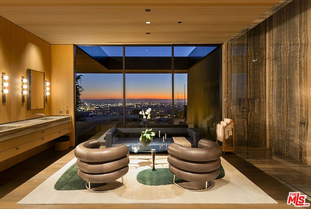 living area featuring wood walls and wooden ceiling