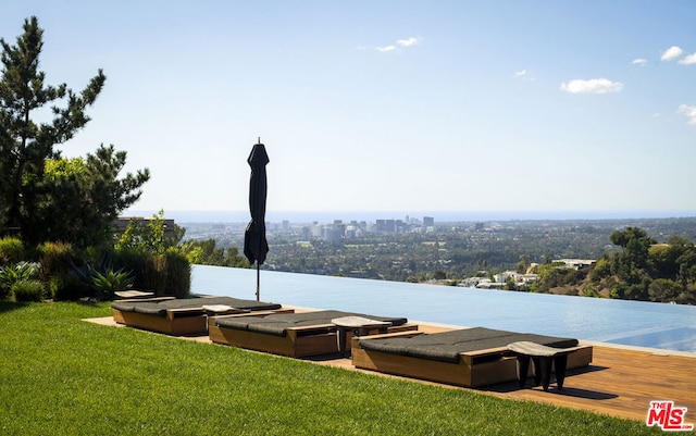 exterior space featuring a yard and a water view