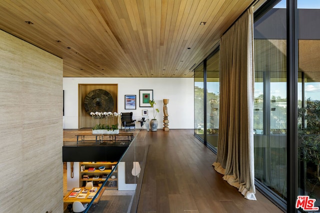 hall with floor to ceiling windows, hardwood / wood-style floors, and wooden ceiling