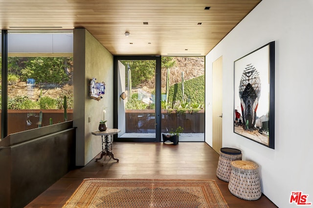 sunroom / solarium featuring wooden ceiling