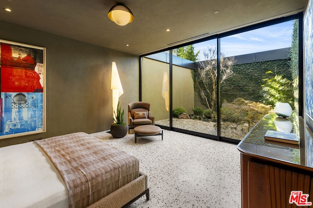 bedroom featuring expansive windows