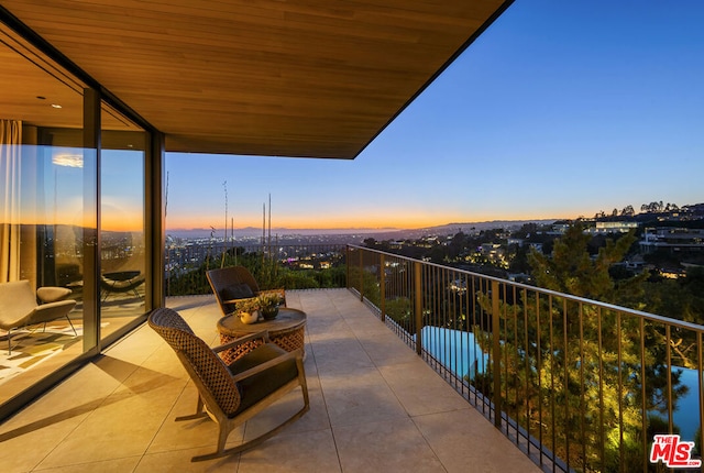 view of balcony at dusk