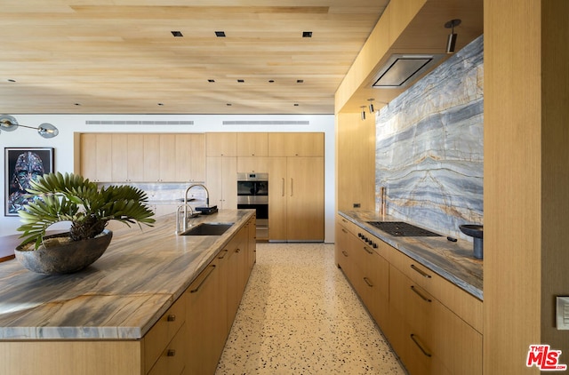 kitchen featuring wood counters, a spacious island, wooden ceiling, and sink