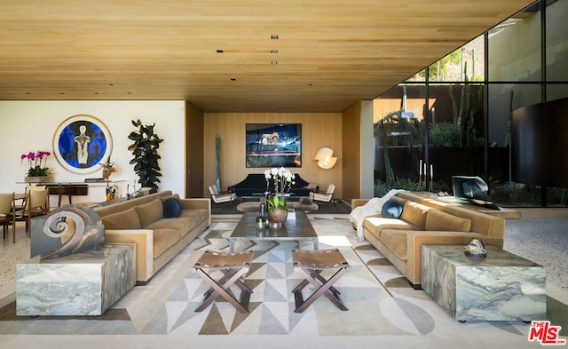 living room featuring floor to ceiling windows and wood ceiling