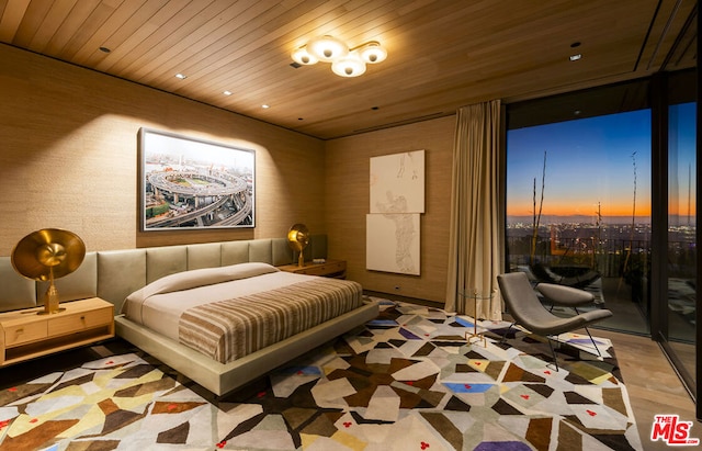 bedroom with wood ceiling and light hardwood / wood-style floors