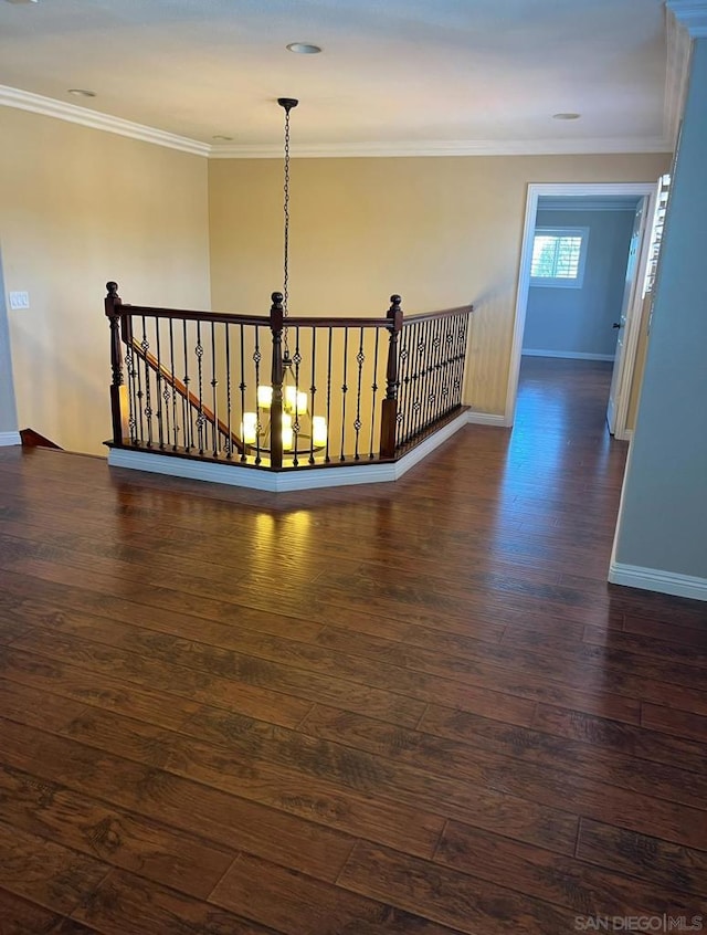 hallway featuring dark hardwood / wood-style floors and crown molding