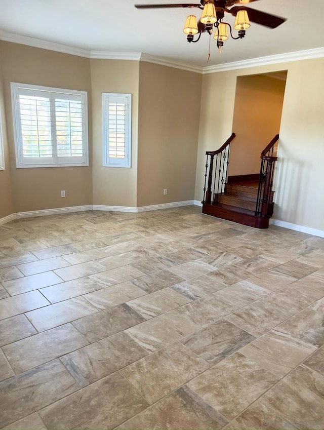 empty room with ornamental molding and an inviting chandelier