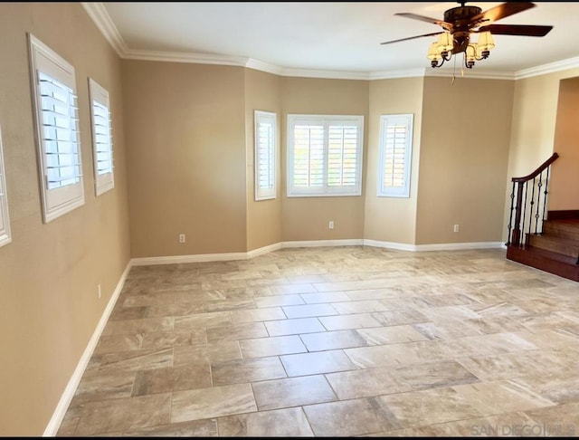 spare room featuring ceiling fan and crown molding