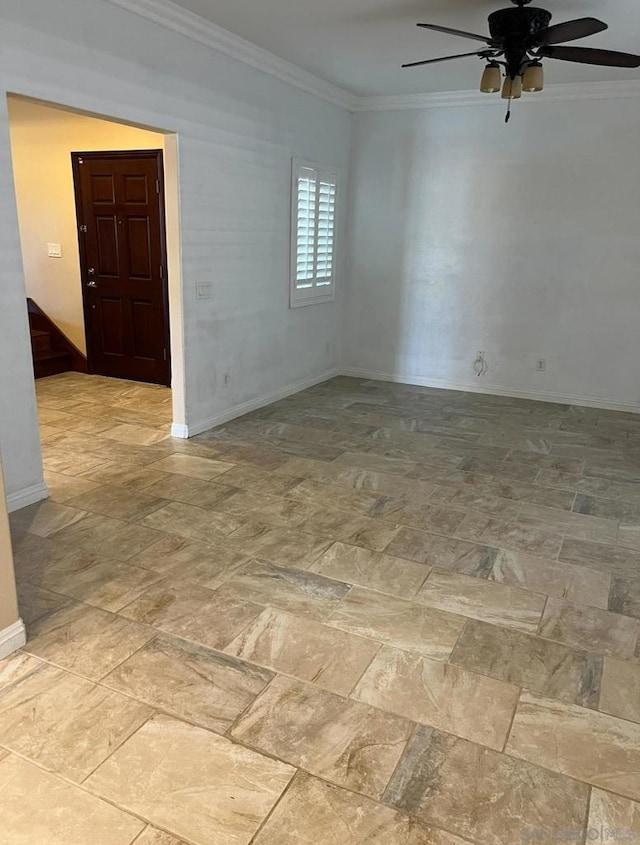 spare room with ceiling fan and ornamental molding