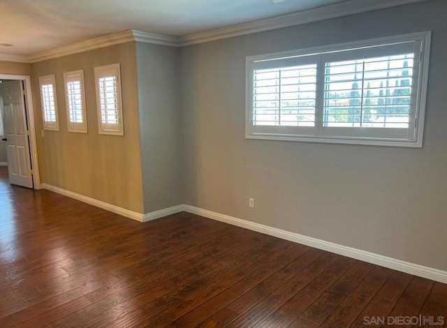 unfurnished room featuring dark hardwood / wood-style flooring and crown molding