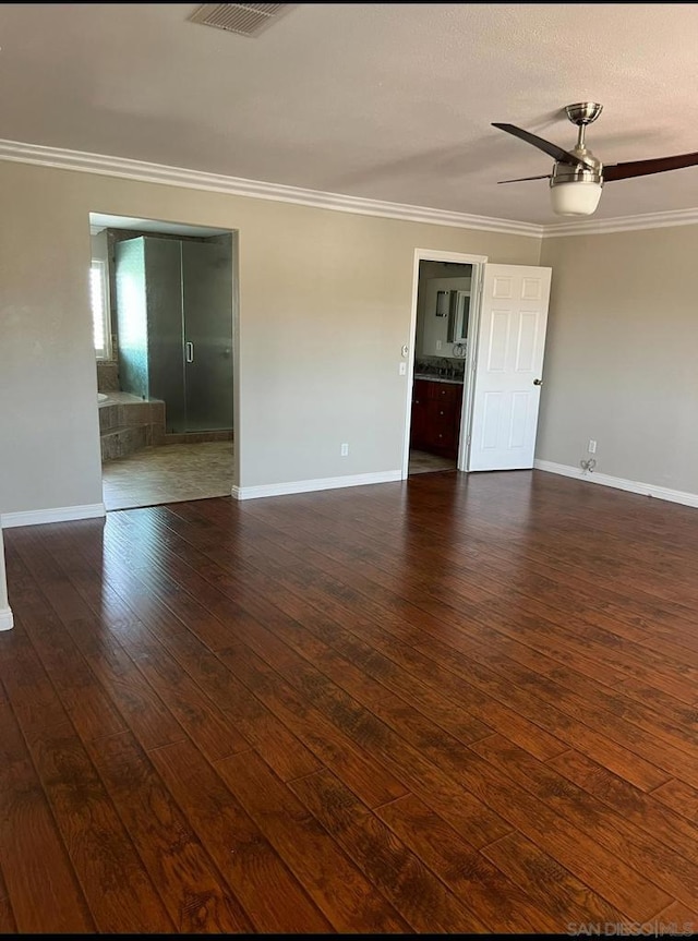 unfurnished room with ceiling fan, crown molding, and dark hardwood / wood-style floors