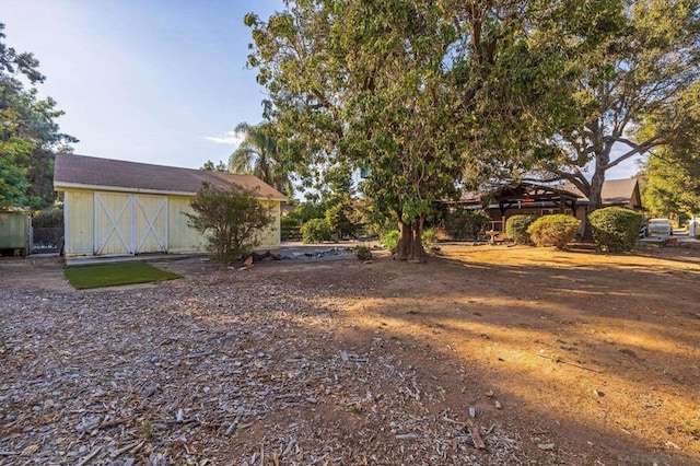 view of yard with a gazebo and an outdoor structure