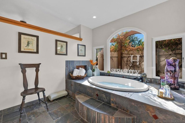 bathroom featuring a tub to relax in