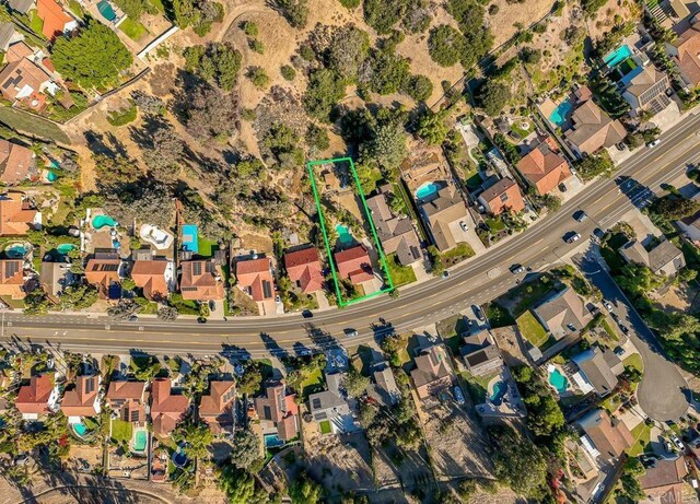 birds eye view of property featuring a mountain view