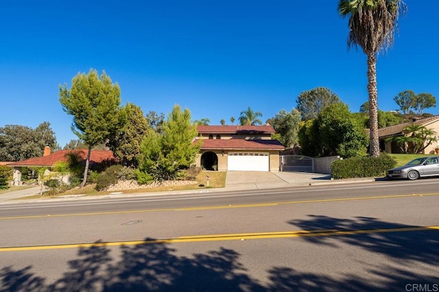 view of front of home with a garage and concrete driveway