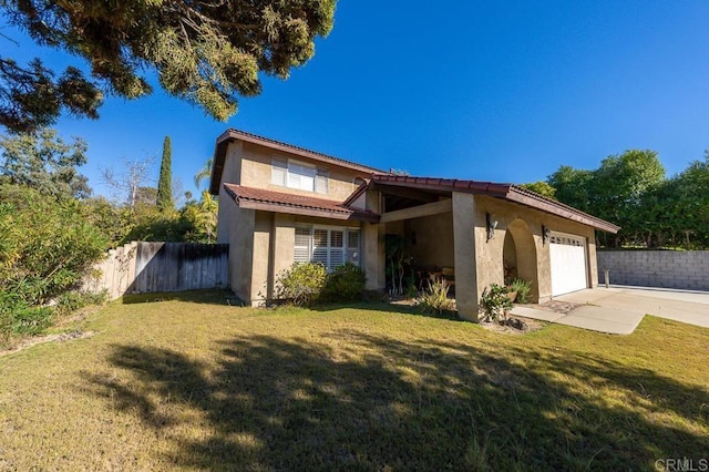 view of front of property with a garage, fence, concrete driveway, stucco siding, and a front lawn