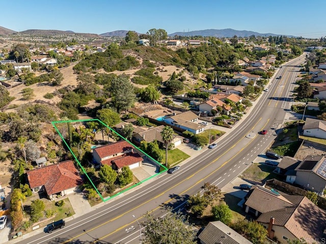 drone / aerial view with a residential view and a mountain view