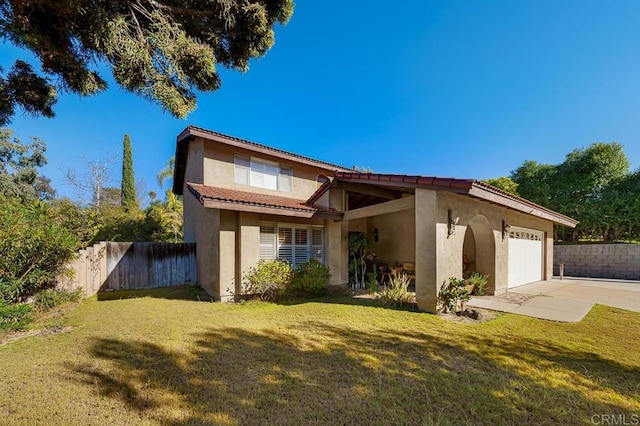 view of front of house with a garage, a tile roof, fence, stucco siding, and a front lawn