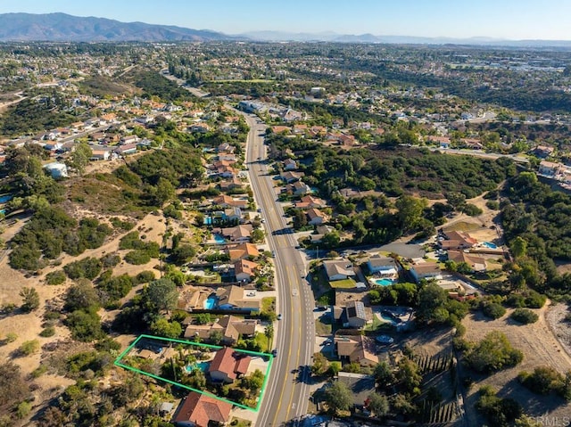 drone / aerial view with a residential view and a mountain view