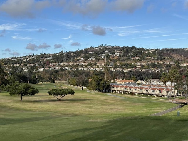 surrounding community featuring a yard