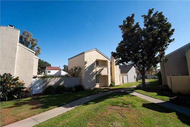 view of side of home featuring a lawn