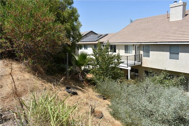 view of home's exterior with solar panels